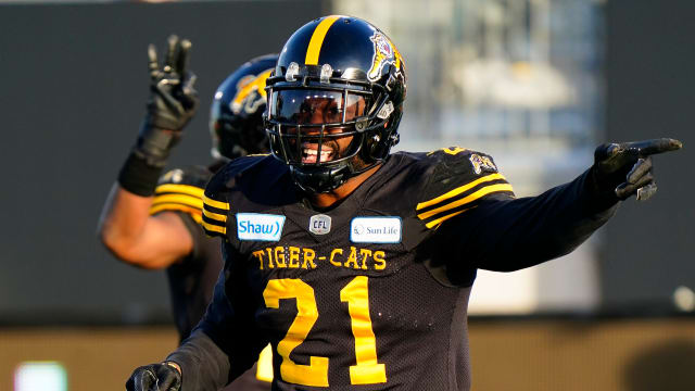 Nov 17, 2019; Hamilton, Ontario, CAN; Hamilton Tiger-Cats linebacker Simoni Lawrence (21) gestures to the Edmonton Eskimos during the CFL Eastern Conference Final football game at Tim Hortons Field. Mandatory Credit: John E. Sokolowski-USA TODAY Sports  